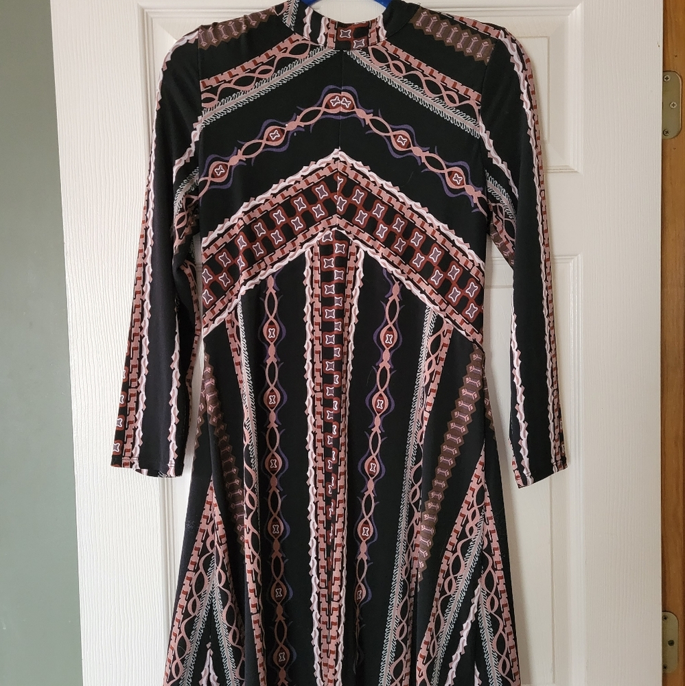 Wrist length, super flattering,  above the knee length dress from free people.